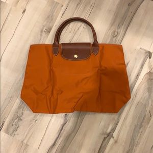 Never been used Longchamp orange bag